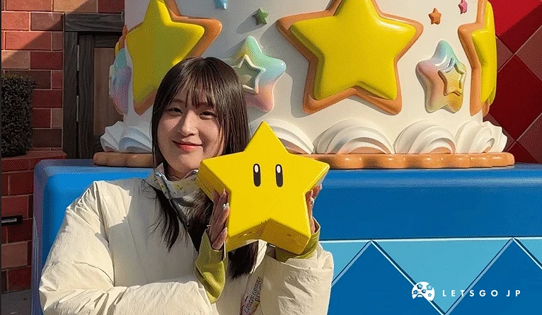 女生手拿無敵星星和背後的蛋糕